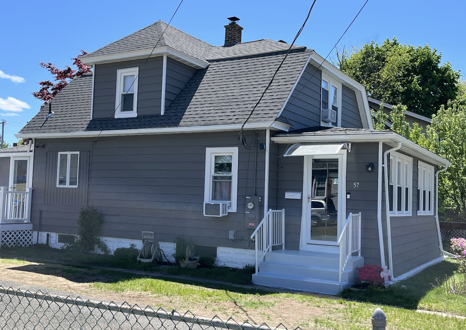 Aluminum siding exterior painting transformation in Enfield CT by Blue Diamond Painters